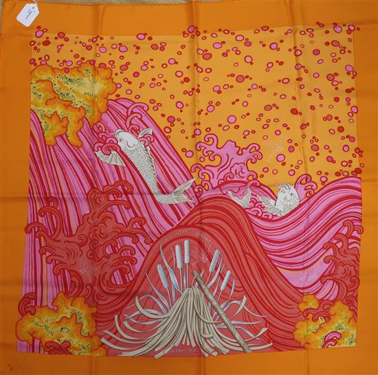 Two Hermes silk scarves, A Contre Courante (orange border) and Chapeau (brown ground),